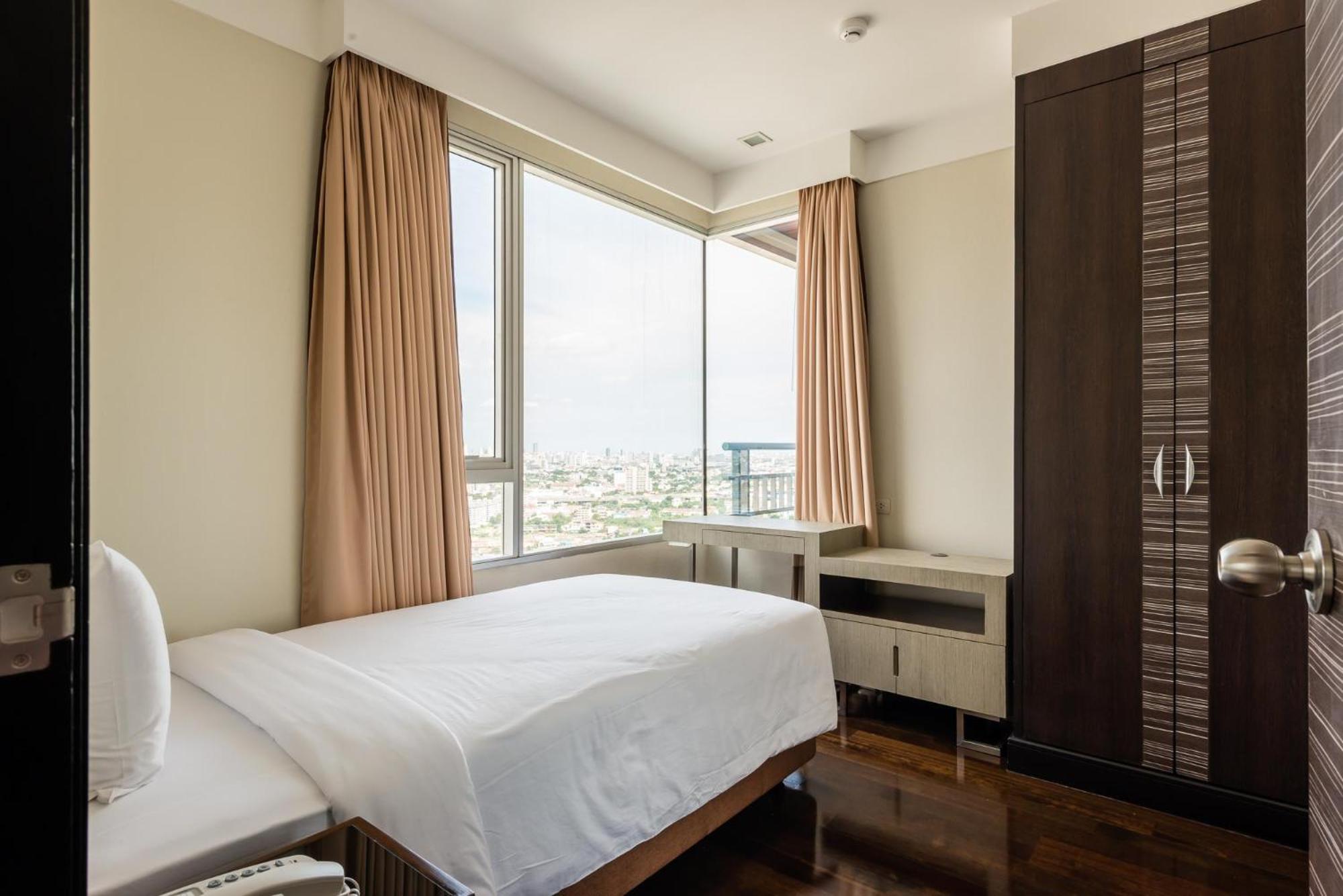 Jasmine Grande Residence Бангкок Екстер'єр фото A bedroom in a serviced apartment in Cairo, Egypt